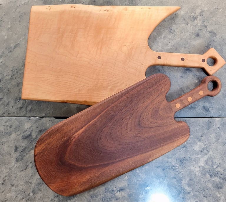 Two handmade cutting boards by J & D Ochoa Woodworking