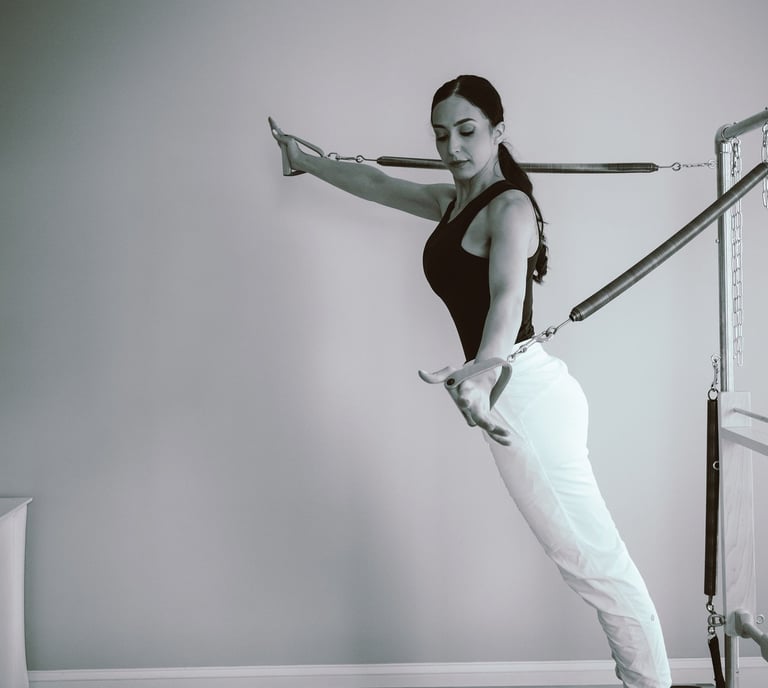 27 Pilates owner on a reformer photography