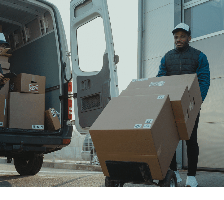 a man is moving boxes of boxes into a van