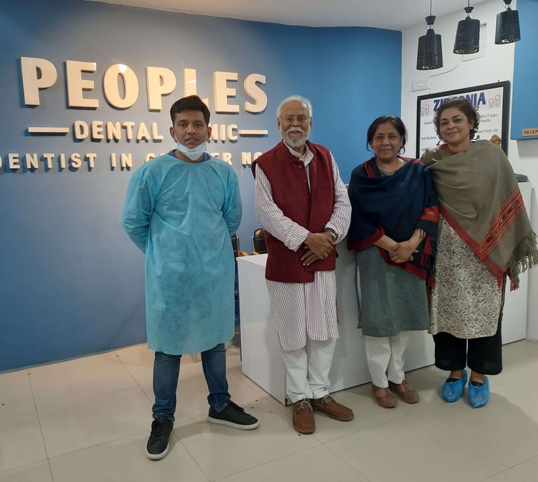 Peoples Dental Clinic - Dr. Ishan Singh with happy dental patients