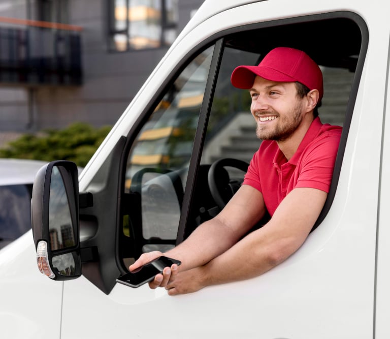 a delivery man in a red shirt and red cap