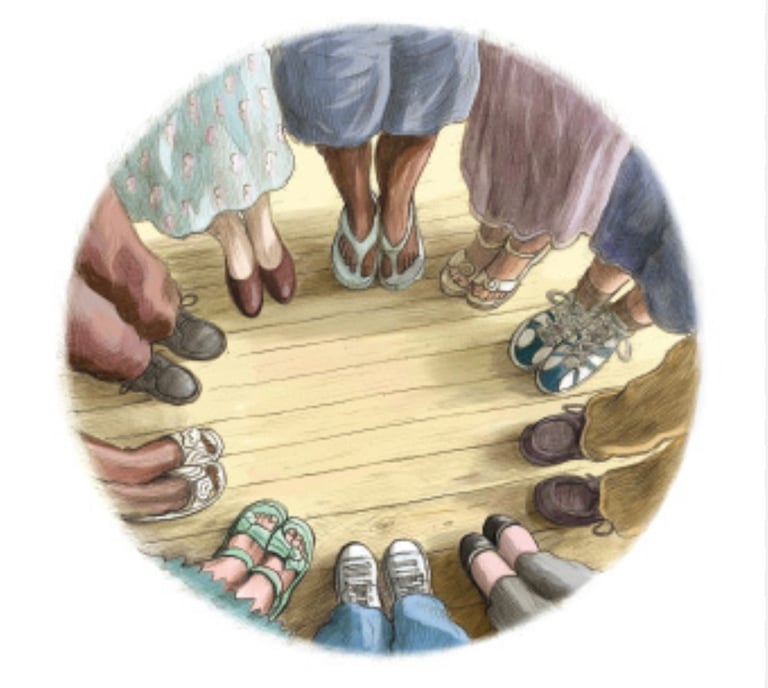 a circle of people standing together so you can look at their feet