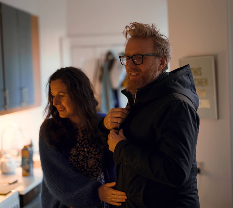 Happy expat couple settled in their Murcia home with comprehensive insurance coverage from Allianz