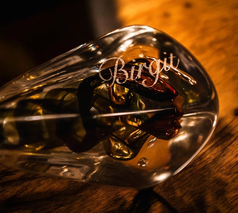 a glass bottle of wine with a message on it