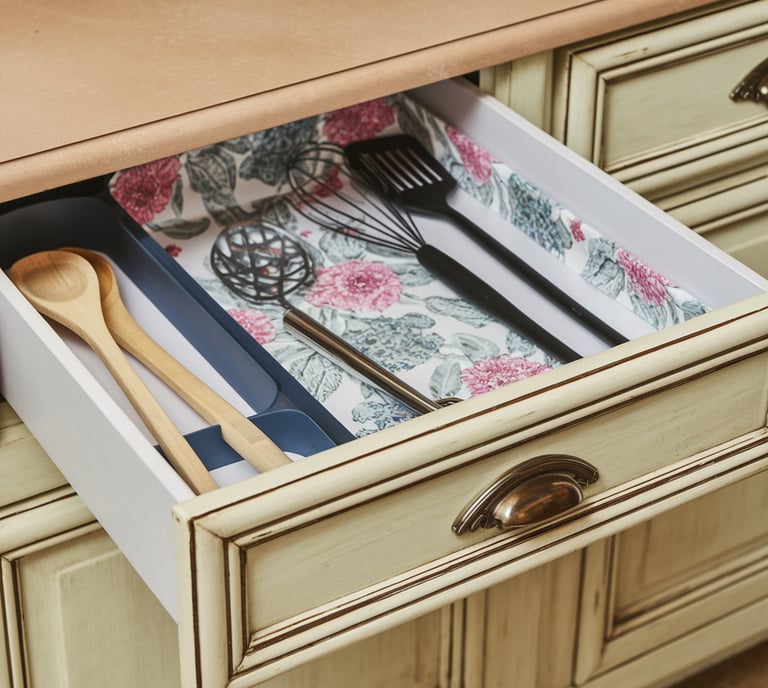 a drawer with utensils in it