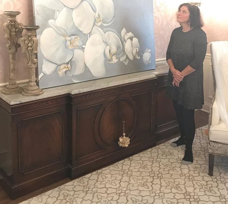 marcine standing next to a custom canvas art painting in mercer county nj