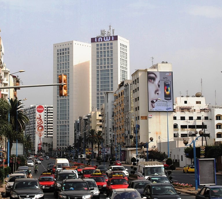 morocco casablanca a busy street with cars parked on the side of the road