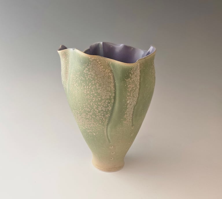 porcelain tulip vessel, pale green & lavendar microcrystalline glaze. Handbuilt. Highfired ^10