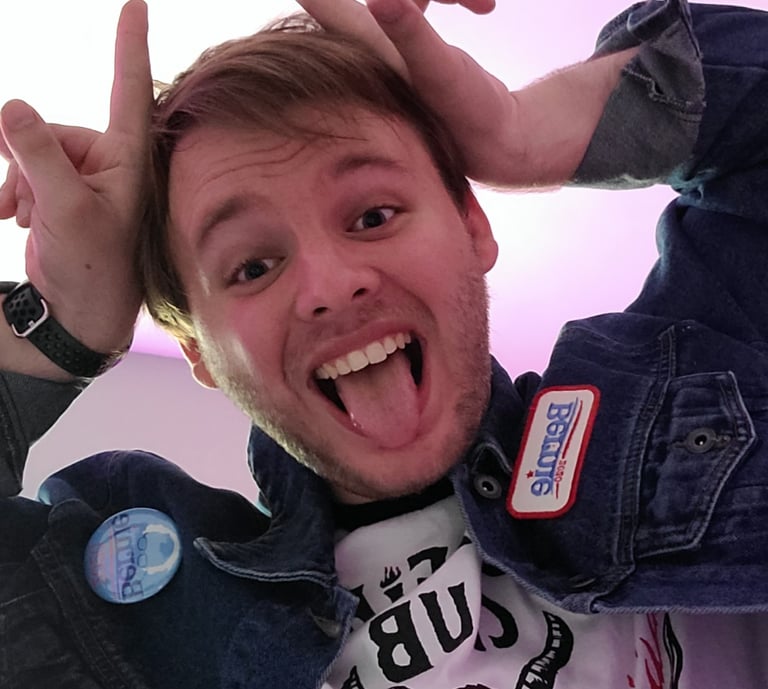 An image of the shop owner, Jacob, doing a pose similar to Eddie Munson