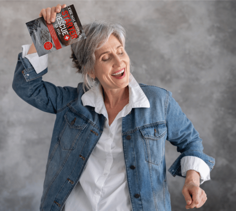 older woman holding the sourdough starter guide book