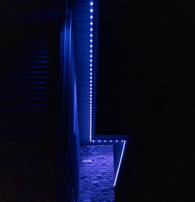 closeup of the house with the lights on the soffits