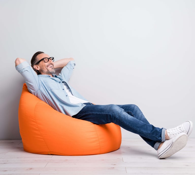 a man sitting on a bean bag chair