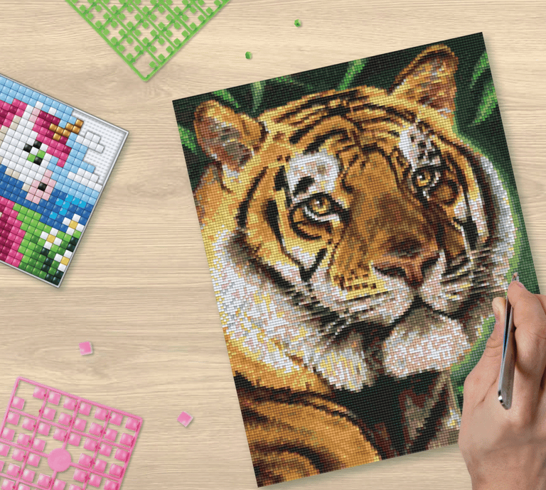 A small picture of colorful unicorn and big picture of colorful tiger made using pixel squares
