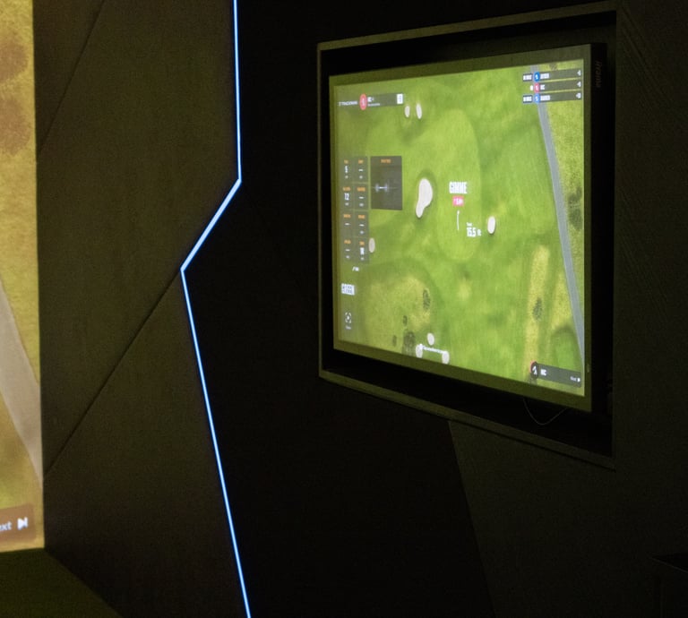 A screen showing Trackman software in an indoor golf simulator bay