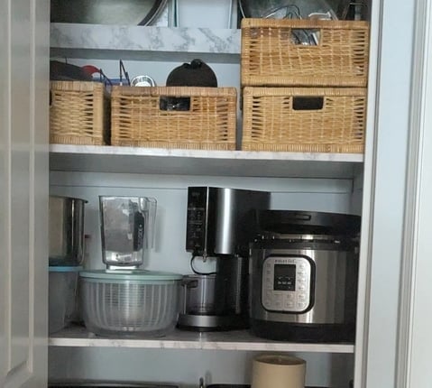 Organized kitchenware closet with strong shelving