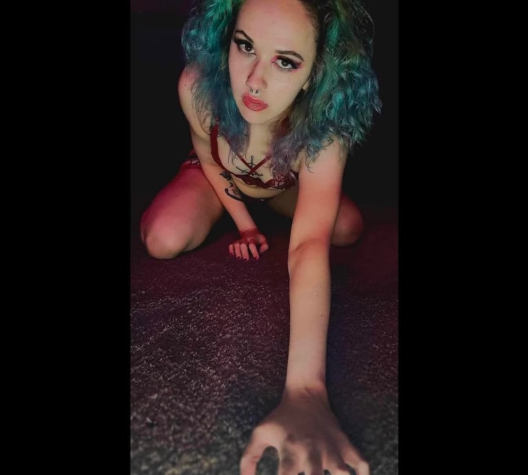 a woman with blue hair and a blue wig