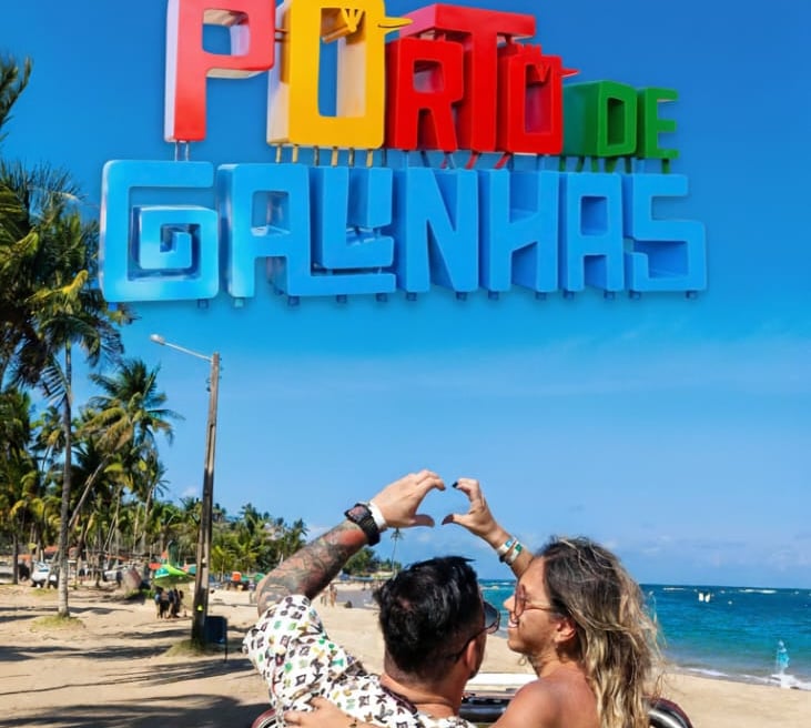 a man and woman sitting in a car
