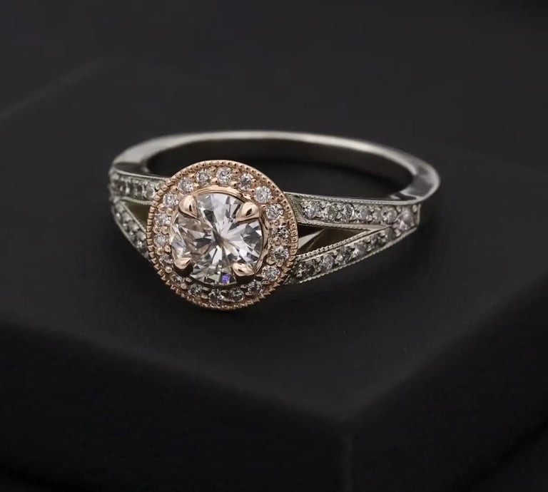 silver diamond halo ring on black box