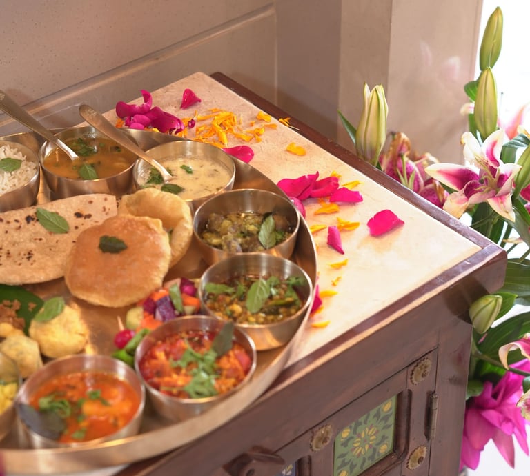 Authentic Gujarati thali at a Pune restaurant with traditional vegetarian dishes, curries, and sweet