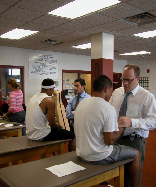 Fellows working at clinic with patients