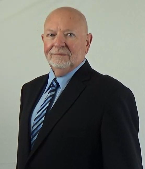 2025 David in a suit and tie with a blue shirt and striped tie