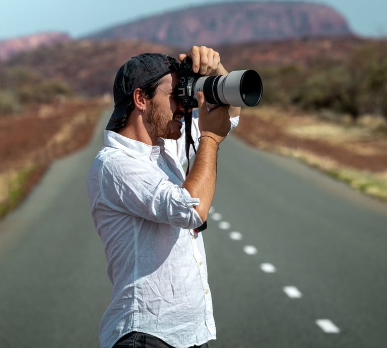 a man taking a picture of himself on the road