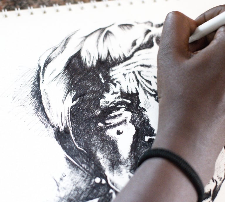 Close up of a woman's hand sketching a portrait with pen.