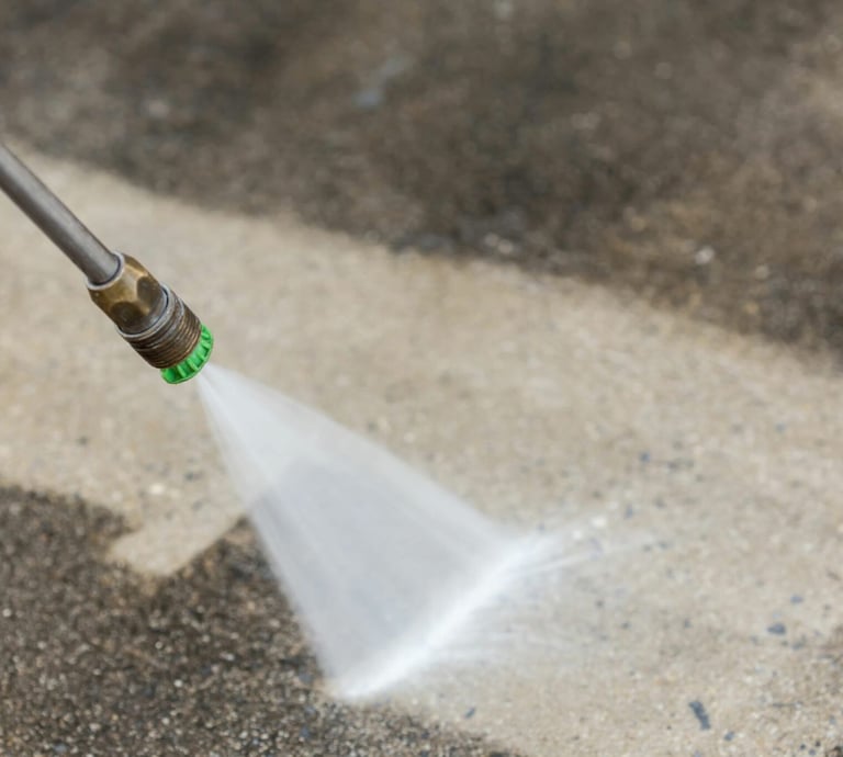 Power washing driveway and sidewalk