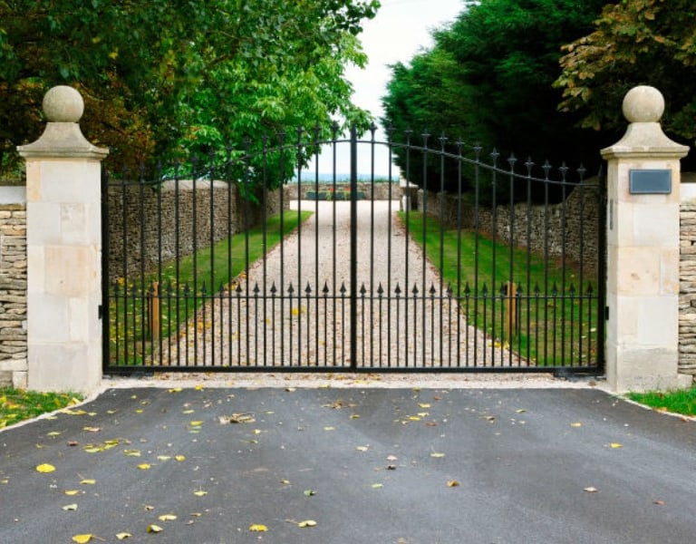 a gated entrance to a house with a gated entrance