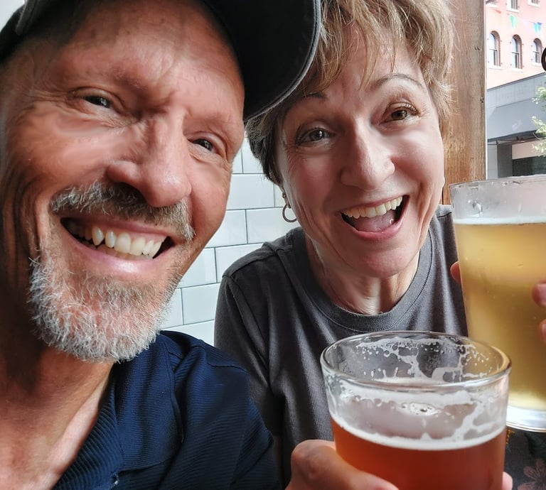 Smiling couple holding glasses of beer