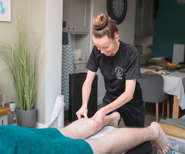 Sports Therapist providing a massage to a client