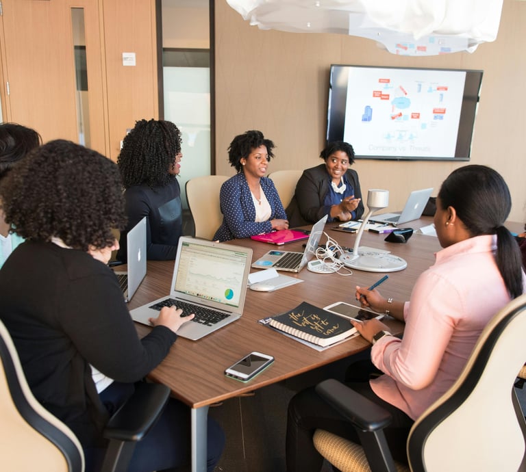 Conference room meeting with 5 people