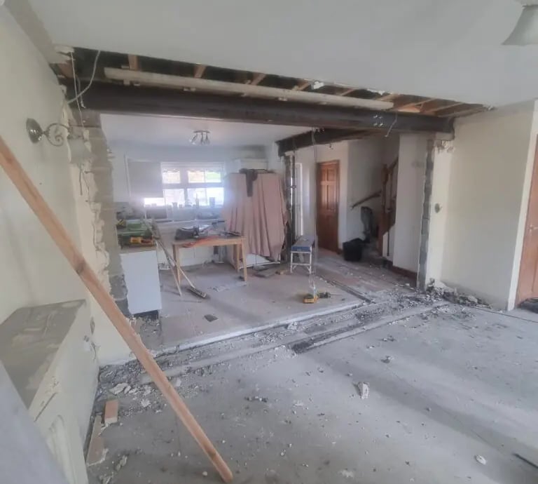 A home kitchen renovation featuring a structural steel RSJ beam installation after wall removal.
