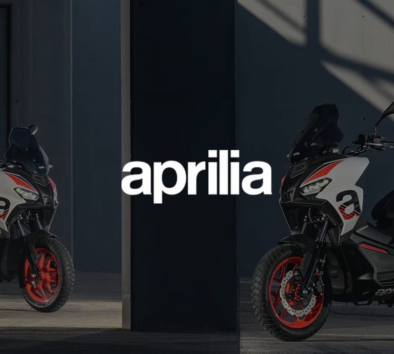 a motorcycle parked in front of a building with the words april on it