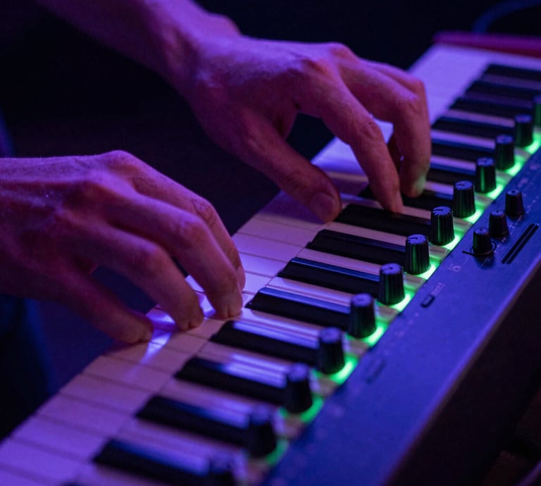 Close-up of hands adjusting dials on an analog synthesizer, neon backlighting, electric violet and green accents.