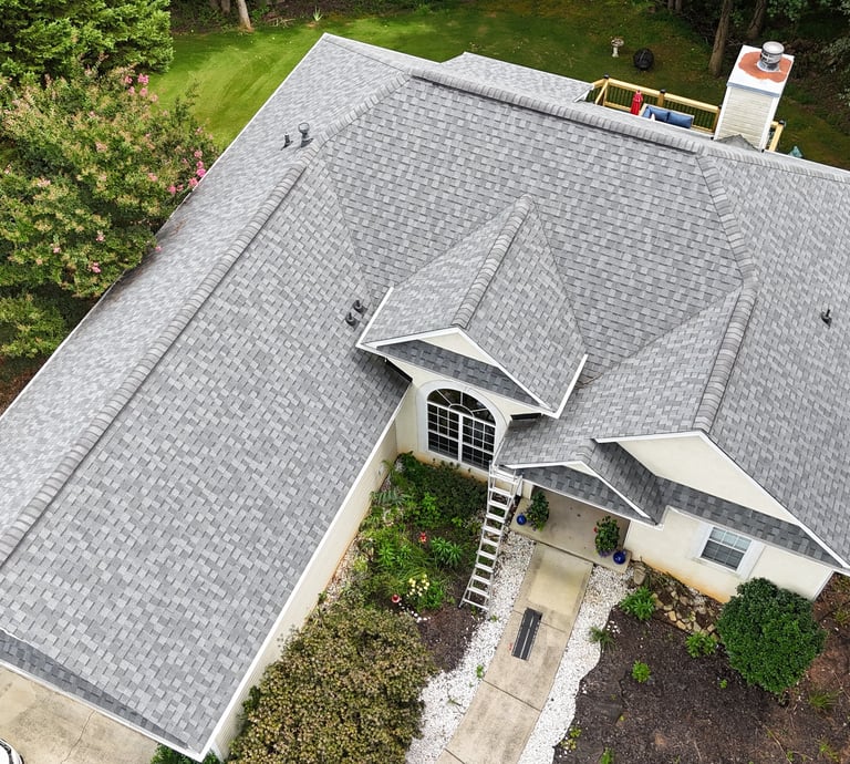a house with a roof that has a gray roof