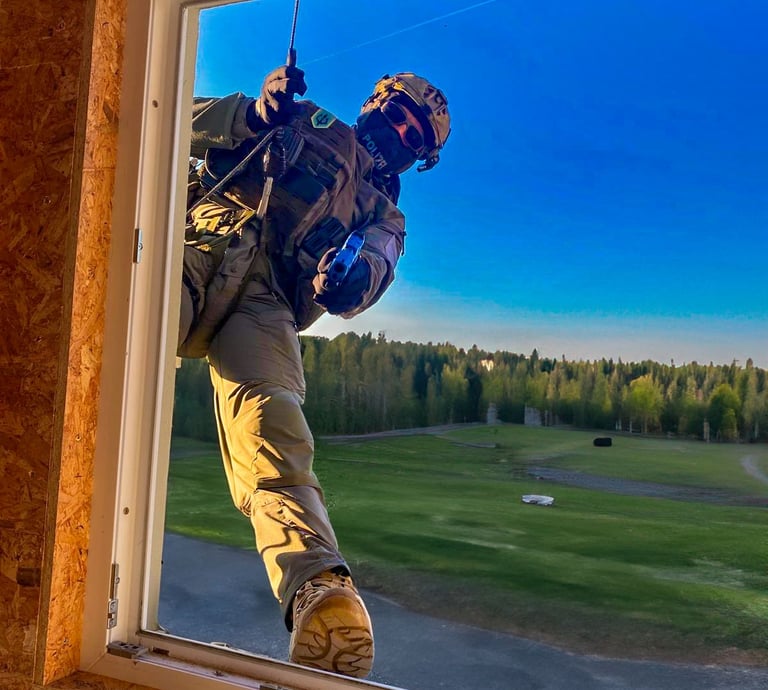 a german piloce officer entring a window with a training gun using the rapid rappel system