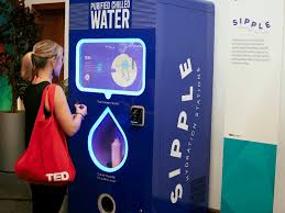 a woman standing in front of a water cooler
