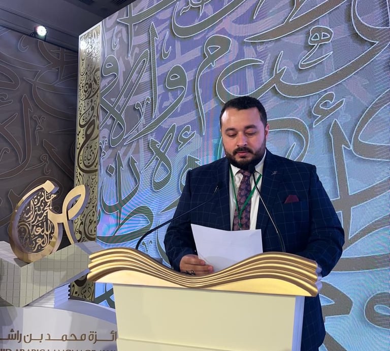 a man in a suit and tie standing at a podium