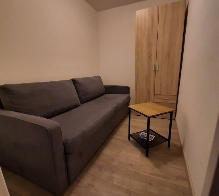 alt="divano letto appartamento affitto val di Fassa"