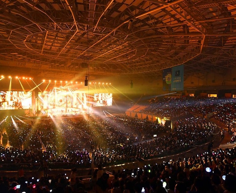 Cheering at a K-pop show—enjoy the concert, save on your stay.