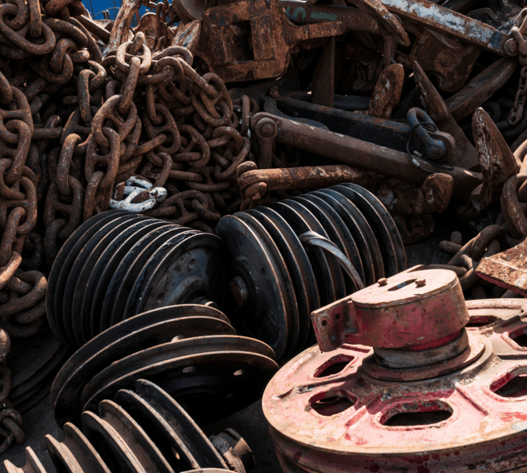 a pile of old rusty metal and chains