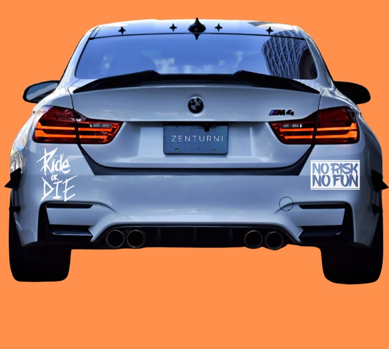 Rear view of a white BMW M4 sports car with custom stickers and quad exhaust on an orange background.
