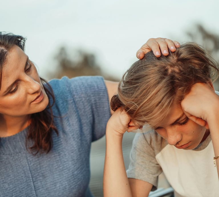 a woman is sitting at a table with a child