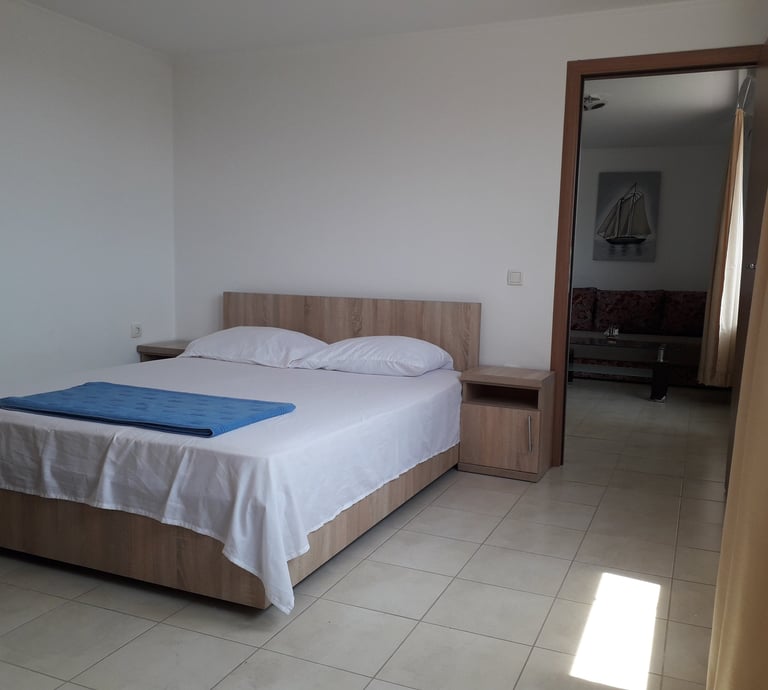 a bed with a blue blanket and a blue blanket