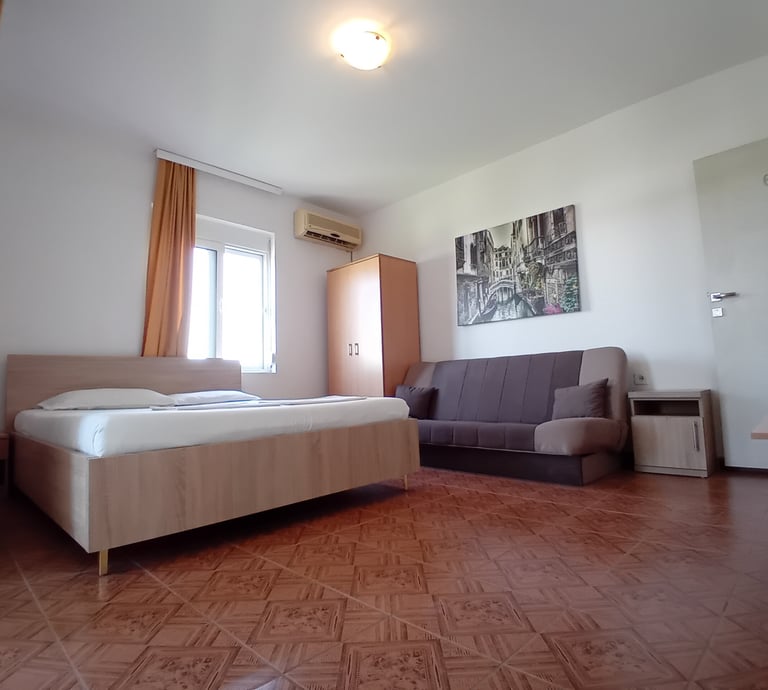 a bedroom with a couch and a couch