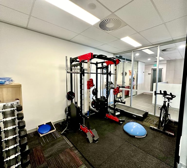 a gym room with a gym equipment and a gym equipment