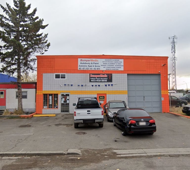 BumperMedic autobody and paint shop offering automotive repair services with cars parked in the lot.