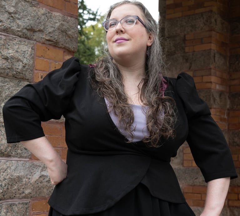 A businesswoman looking confident in front of a stone structure