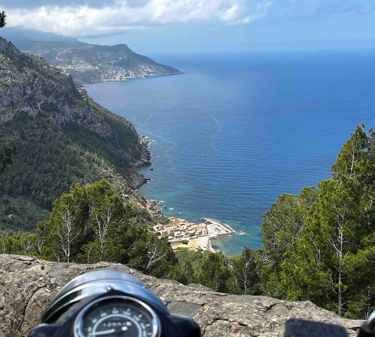 A Royal Enfield Bullet overlooking Valdemossa port in Mallorca